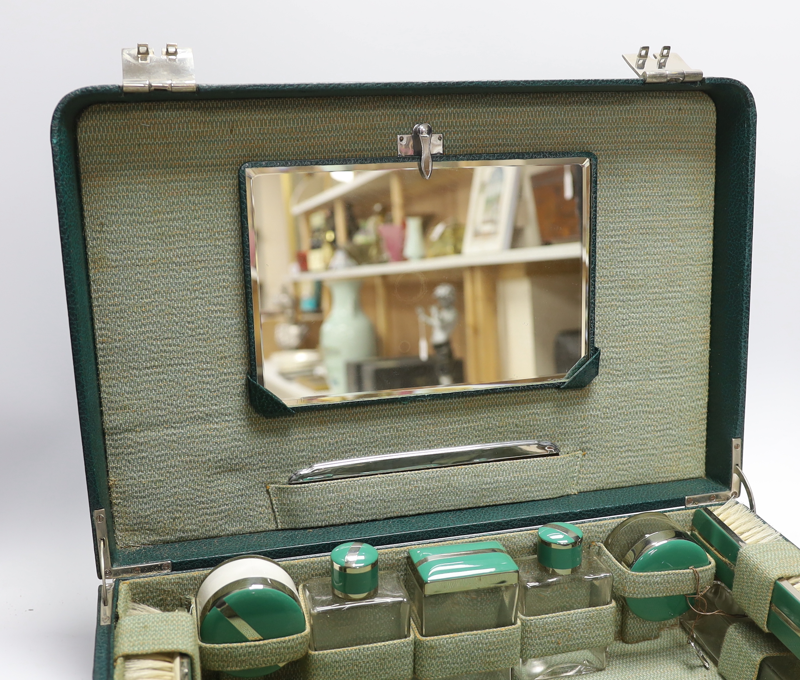 A mid 20th century cased toilet set